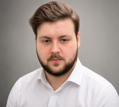 A portrait headshot of Benjamin Shepherd